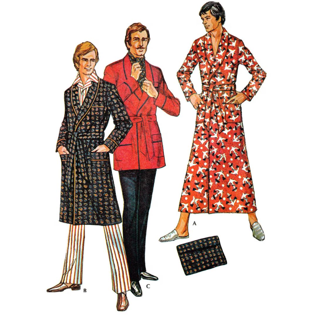 Three men wearing patterned robes and a coat with a white background