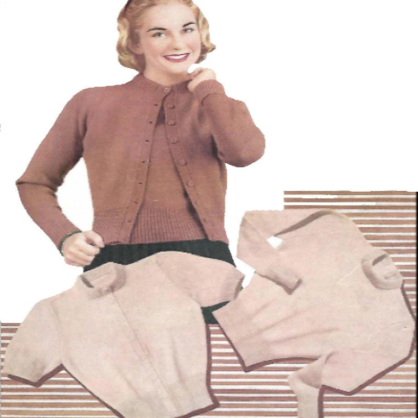 A woman smiling and posing with a beige twin set jumper and cardigan, consisting of a jumper and several cardigan pieces laid out on a surface.