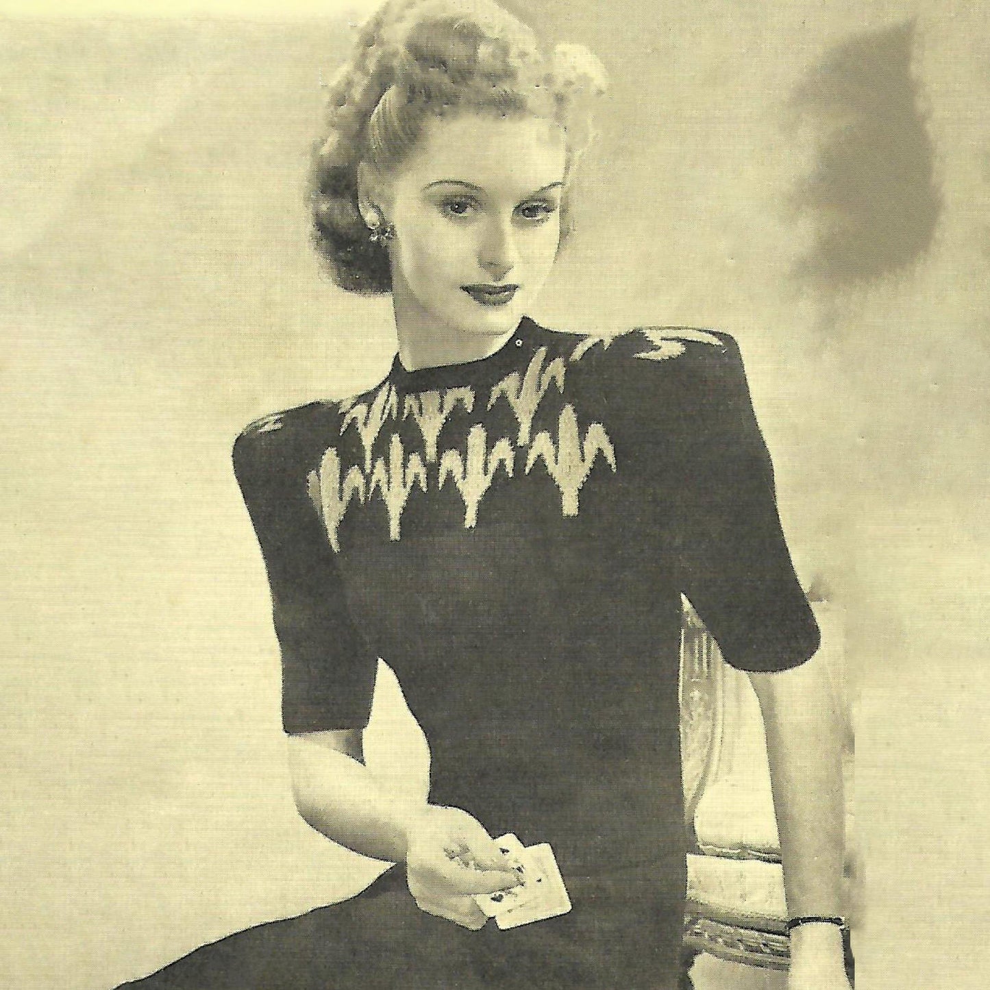 1940's Knitting Pattern, Woman wearing a Fleur De Lis Jumper