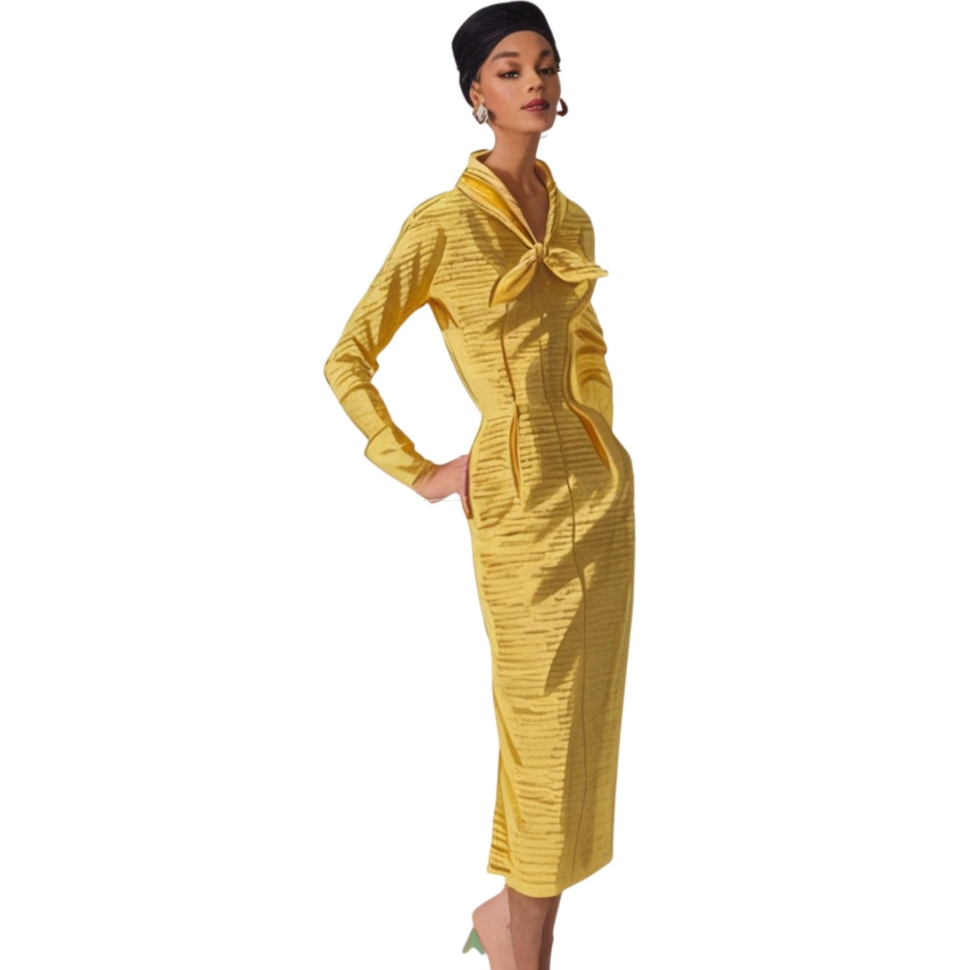 Woman wearing a yellow dress with a bow detail on a white background