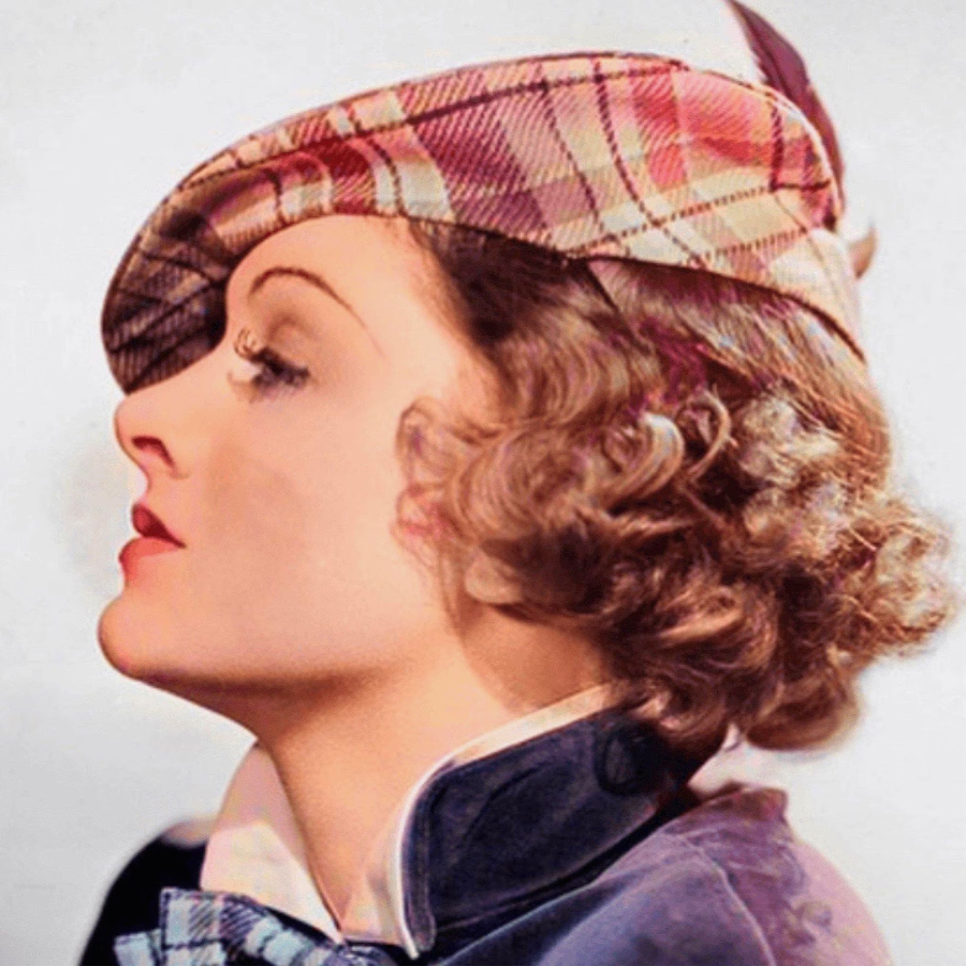 Vintage-style portrait of a woman wearing a plaid hat and coat.