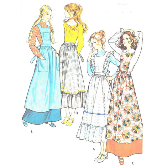 Model wearing pinafores and apron made from McCall’s 2925 pattern