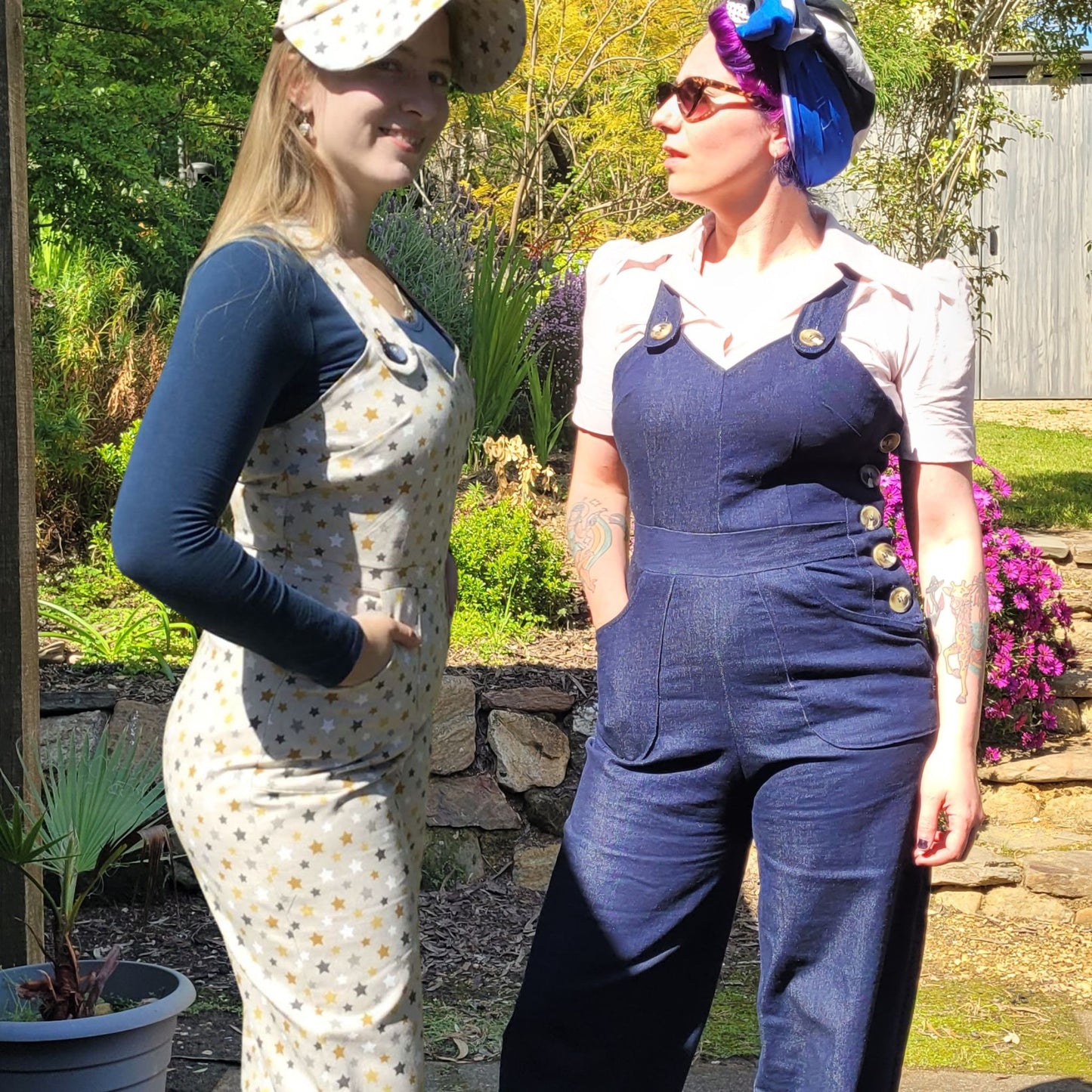 Two women wearing landgirl dungarees made up from a vintage sewing pattern