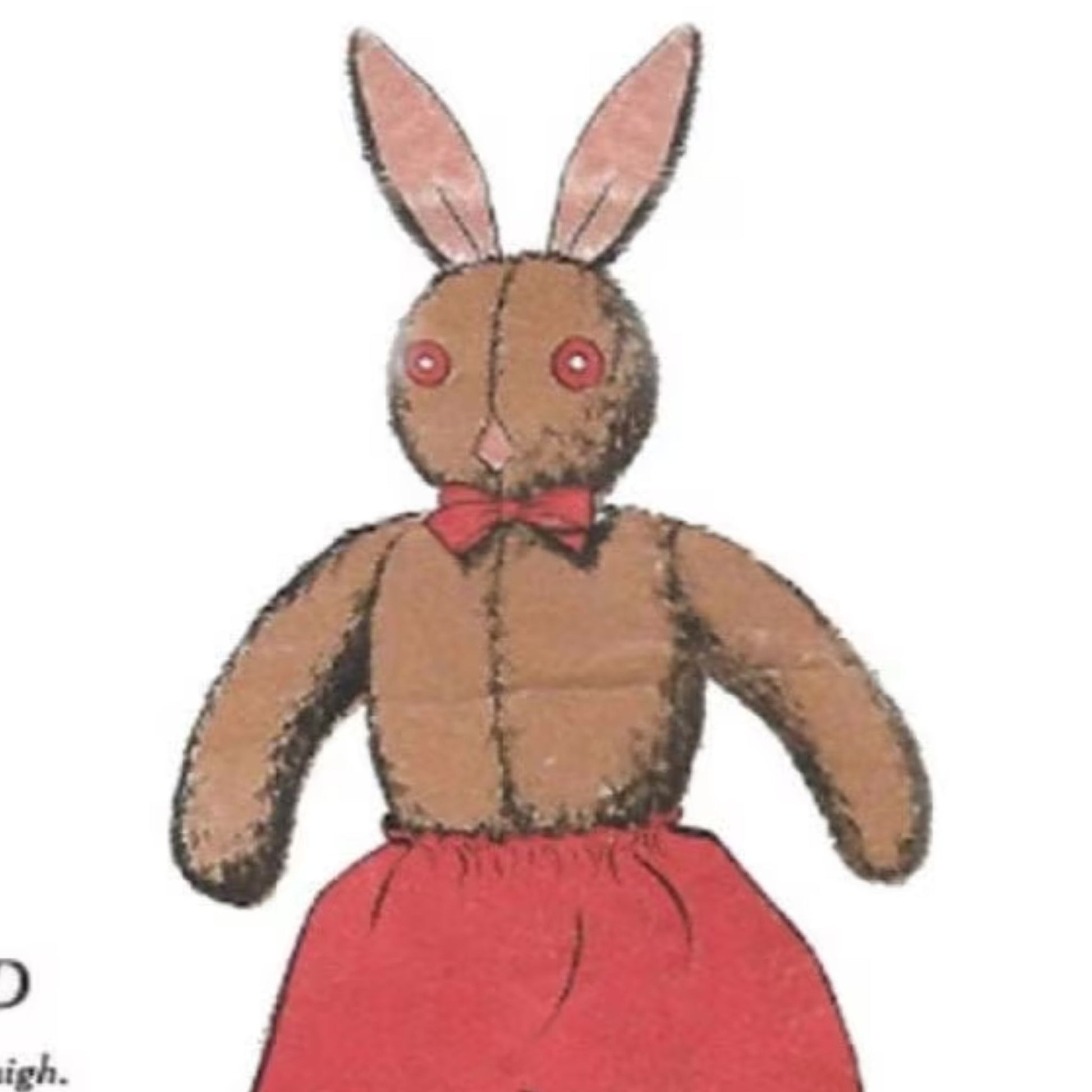 Image of 'Wilfred' stuffed rabbit toy, with brown fur and a red bowtie and trousers.