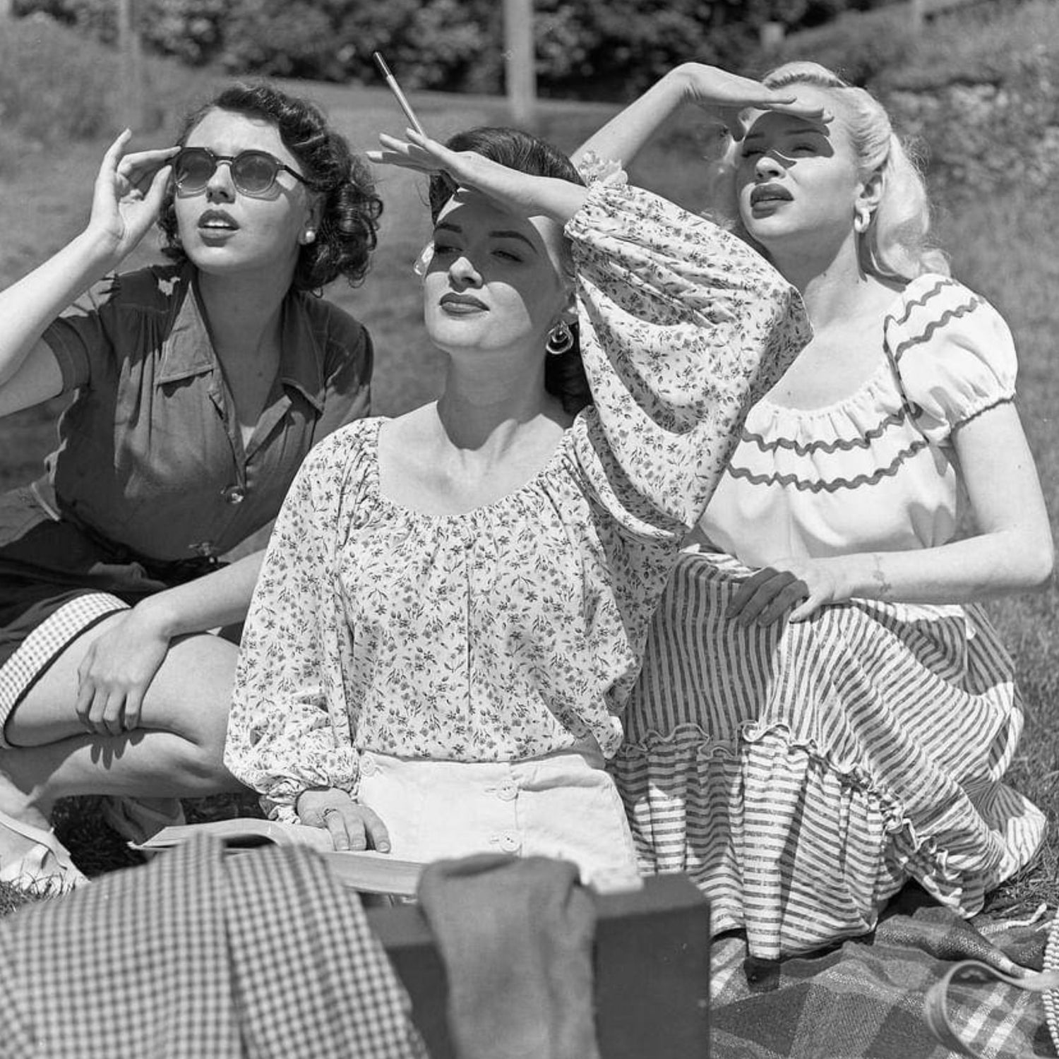 Blonde haired girl and a dark haired girl wearing a 1950s gypsy top