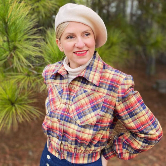Faire haired woman wearing a lumberjacket from the 1940s