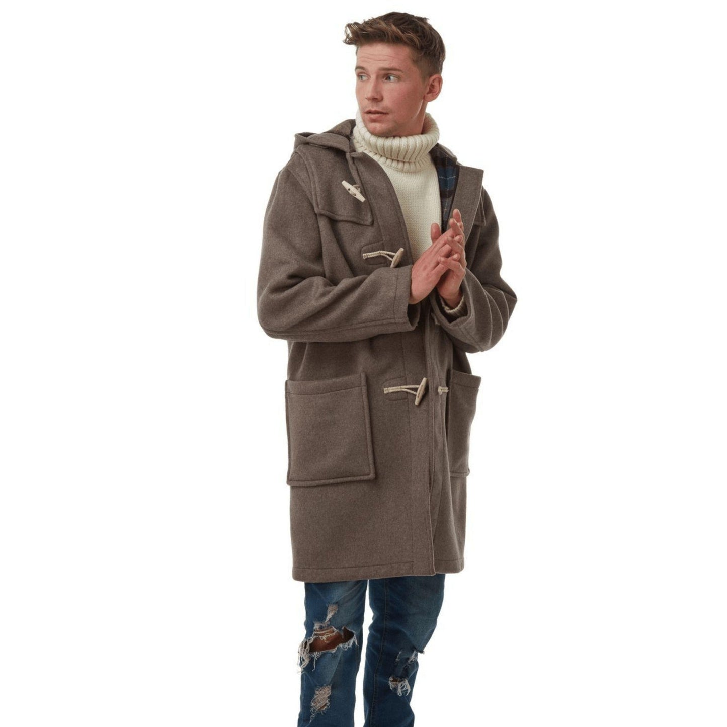 Dark haired man wearing a greyduffle coat made up from a sewing pattern