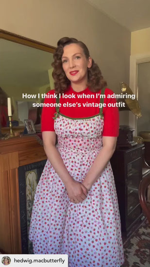 Girl with pin curls wearing red tee under Marilyn Dress