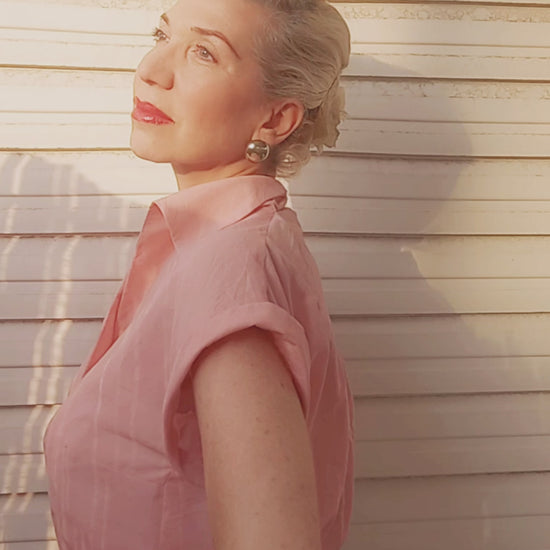 Blonde haired women wearing a pink Arietta Blouse