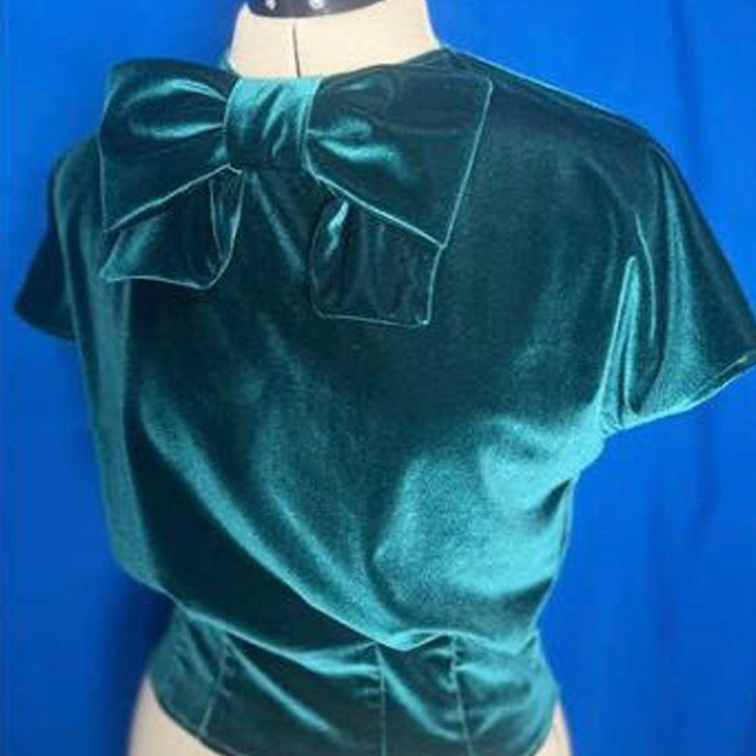 Blouse made in stretch fabric with huge bow at neckline