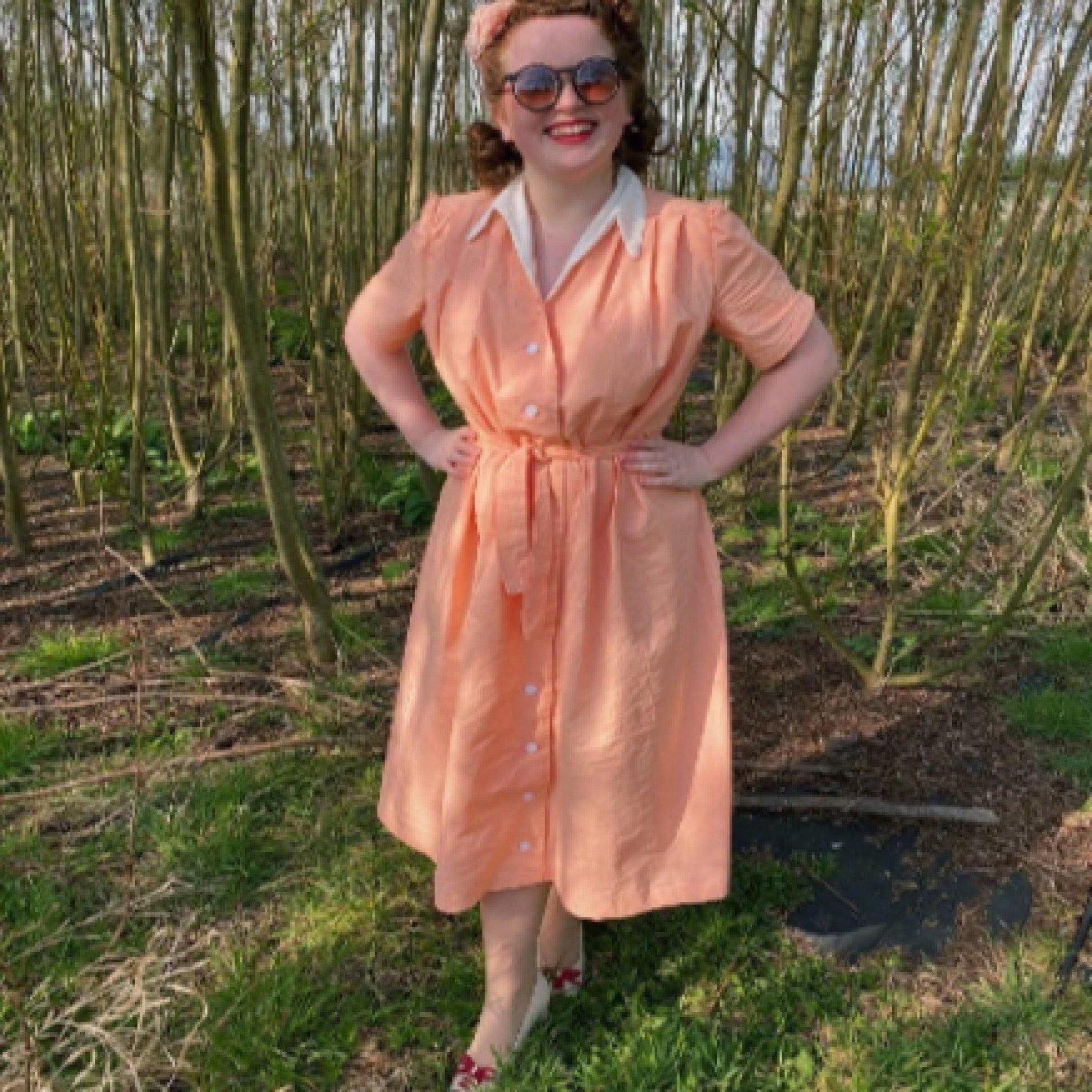 Lady wearing a peach maternity dress