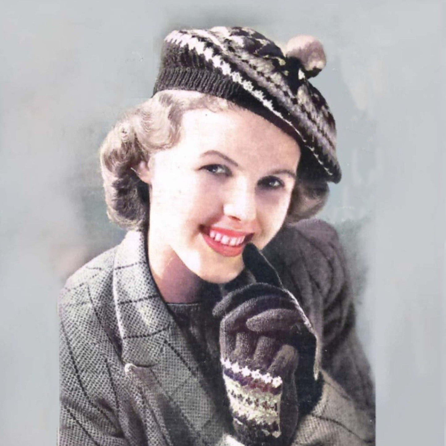 Woman waring a 1940s Knitting Pattern, Fair Isle Beret & Gloves