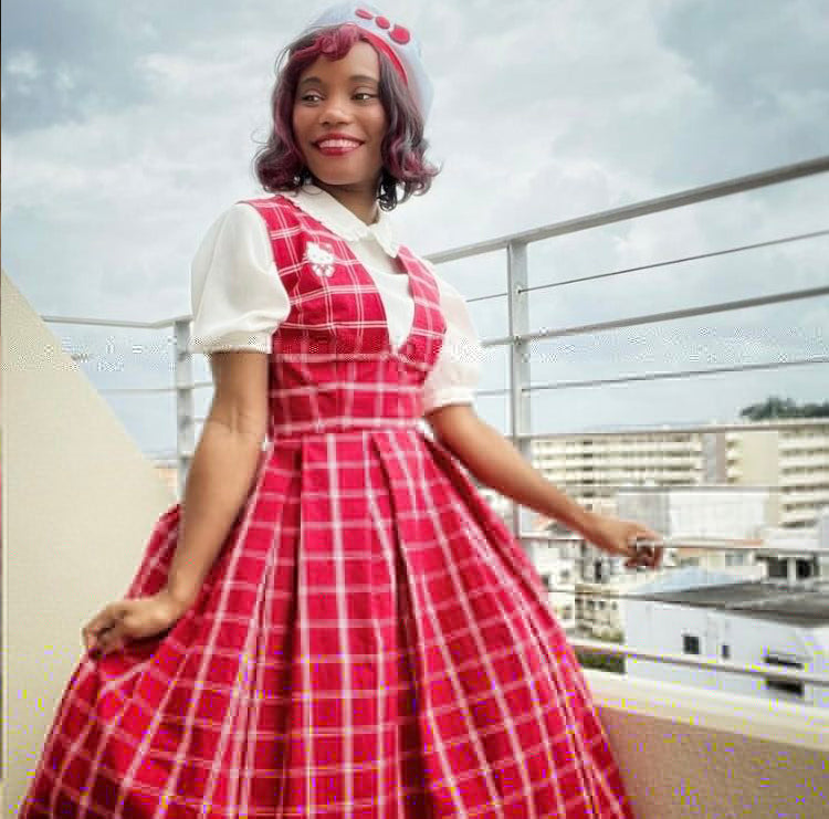 Model wearing 1950s jumper with two skirts and blouse made from Simplicity 3079 pattern