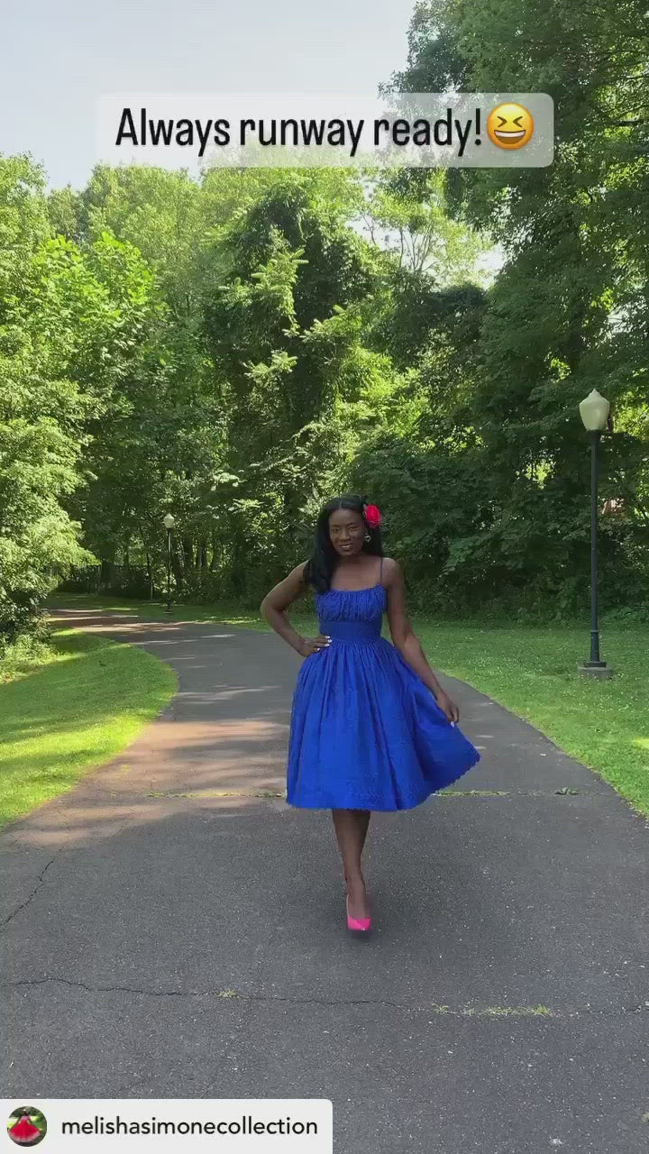 Woman wearing a blue Marilyn Dress 