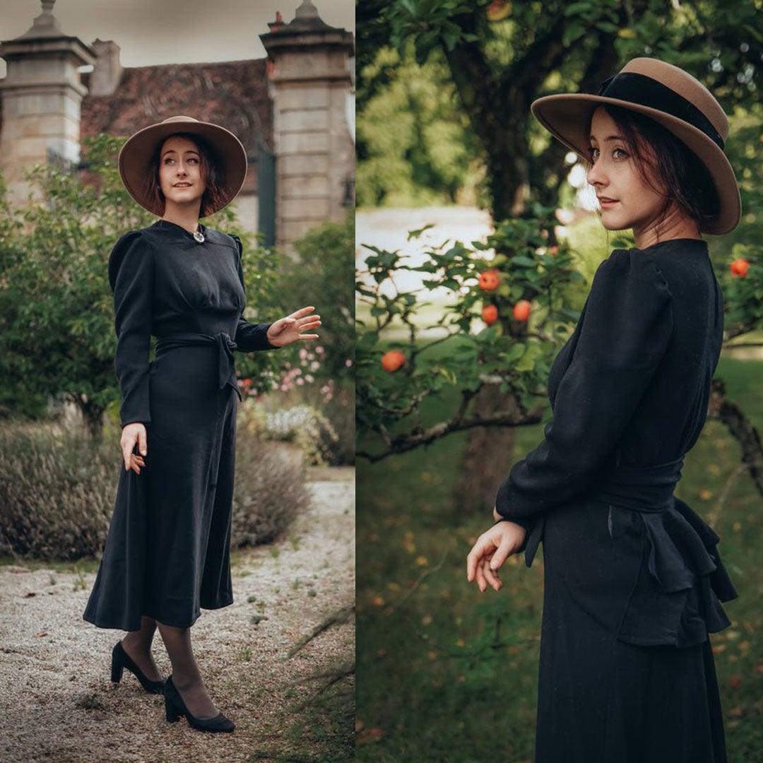 Griisette wearing a self made black 1940s bustle dress.